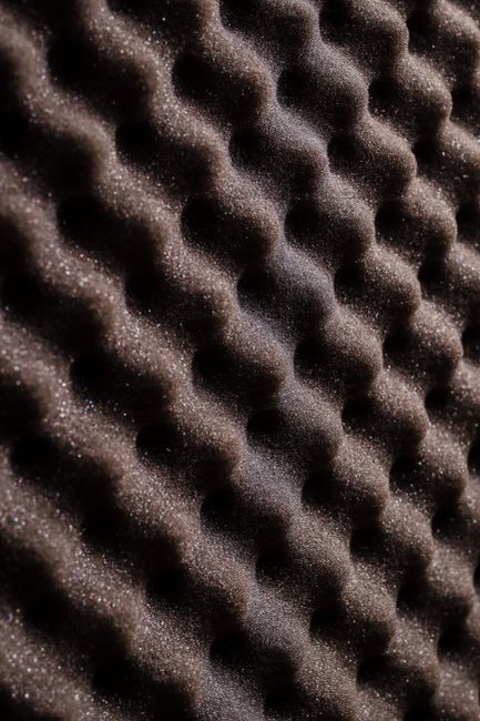 Close-up view of wavy acoustic foam for sound absorption and insulation.