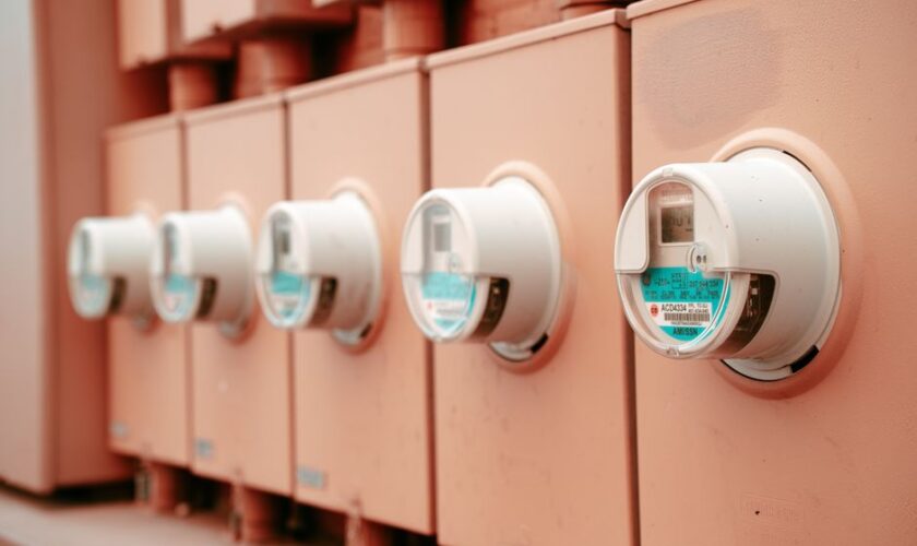 Close-up view of a row of industrial electricity meters for power monitoring and technology.