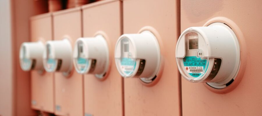 Close-up view of a row of industrial electricity meters for power monitoring and technology.