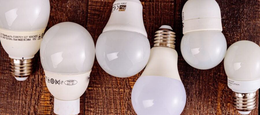 LED light bulbs arranged on a wooden surface, showcasing their modern design.