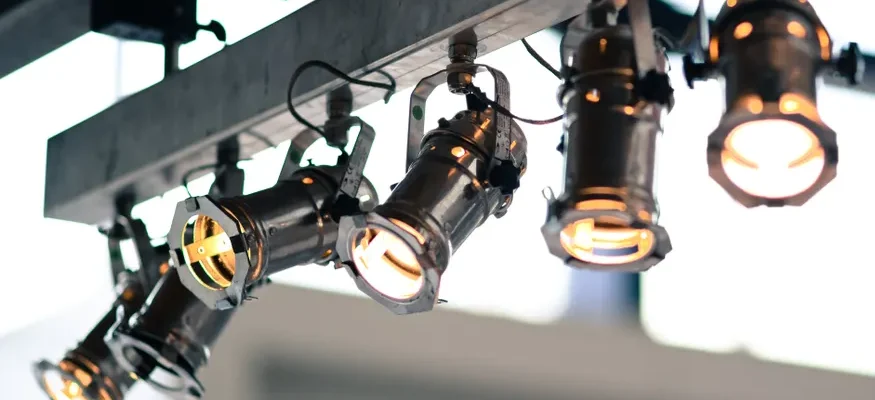 Modern industrial spotlights mounted on a ceiling providing focused illumination.