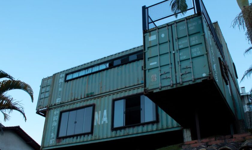 Modern shipping container home in Vila Baependi, Brazil, showcasing creative architecture.