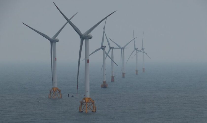 Offshore wind turbines generating clean energy in the ocean breeze.