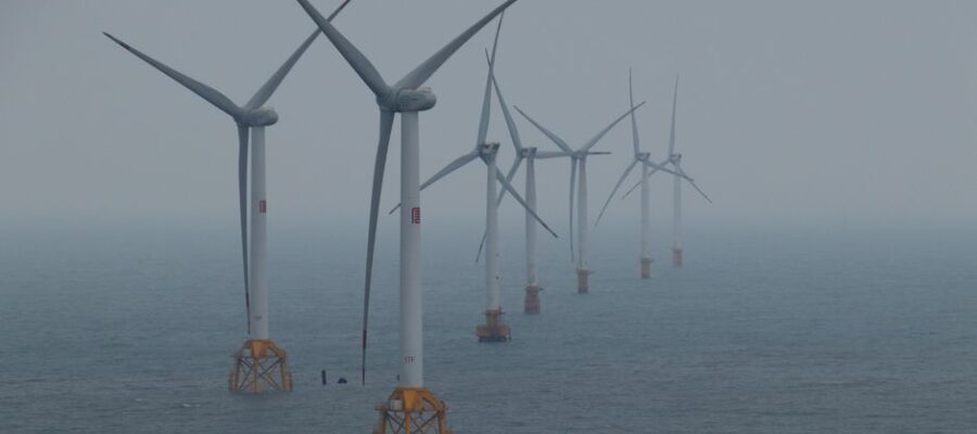 Offshore wind turbines generating clean energy in the ocean breeze.