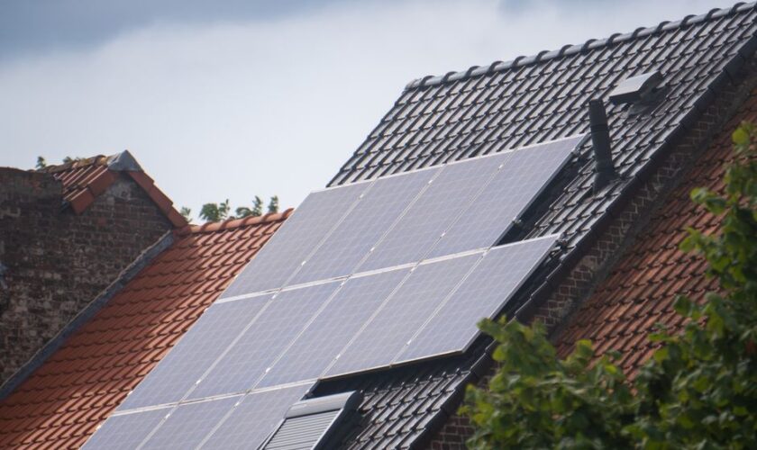 Solar panels installed on a residential rooftop, showcasing eco-friendly renewable energy solutions.