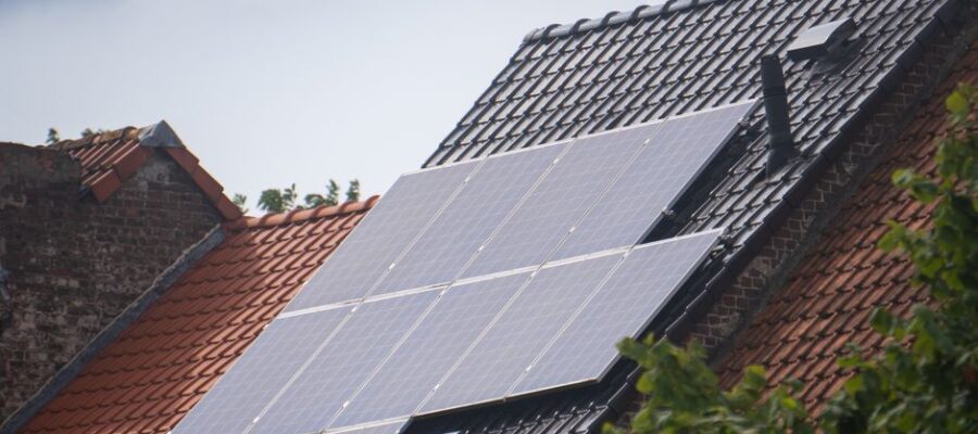 Solar panels installed on a residential rooftop, showcasing eco-friendly renewable energy solutions.