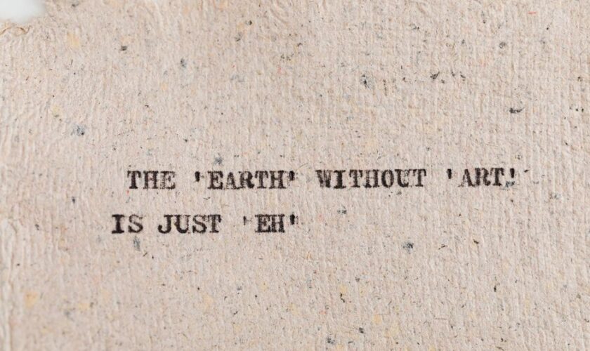 Textured paper with motivational quote highlighting art's importance.