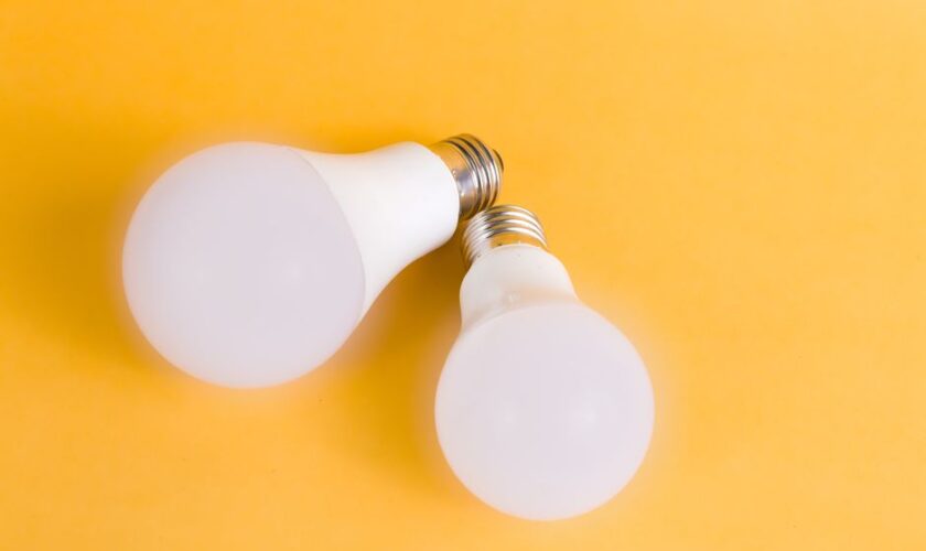 Two LED light bulbs on a bright yellow background, emphasizing modern energy-efficient lighting.