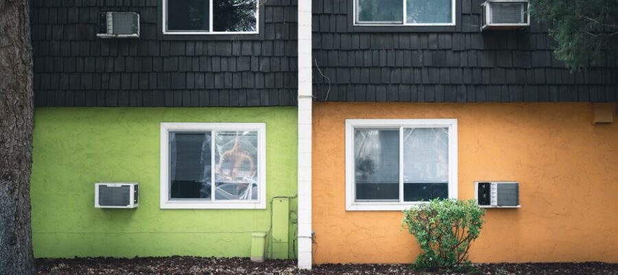Vibrant split-color apartment facade with air conditioners in Boise, Idaho.