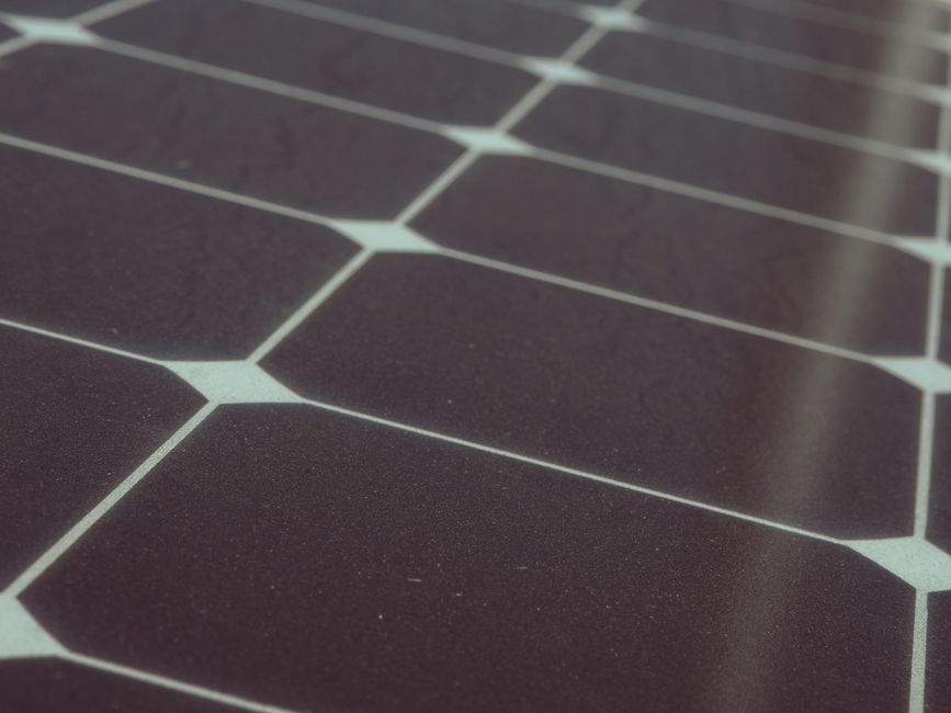 Detailed view of solar panel cells for alternative energy generation and innovation in technology.