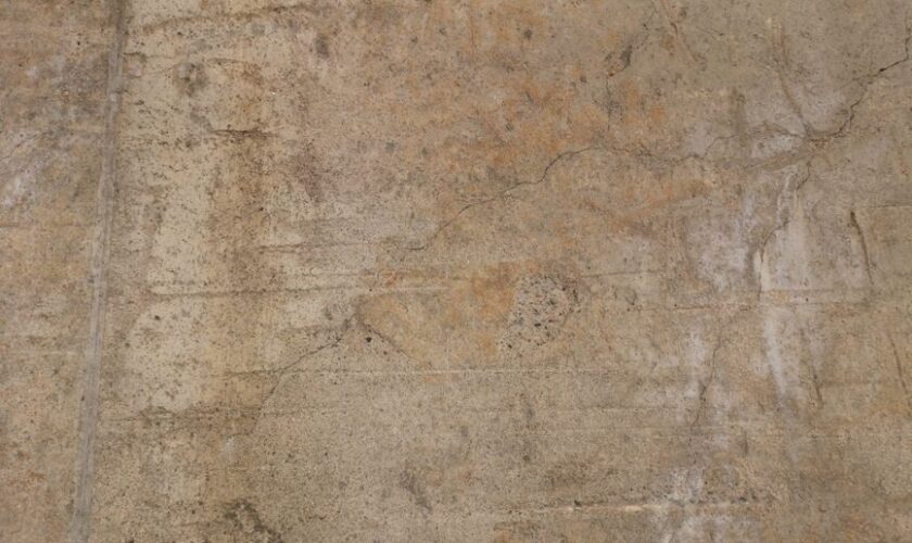 High-resolution image of a weathered concrete wall with rich texture details.