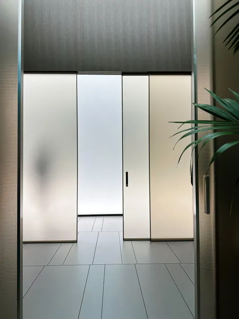 Sleek interior design with frosted glass sliding doors and ambient lighting