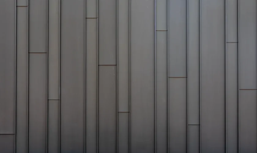 Sleek vertical metal panel wall showcasing a modern minimalist industrial design.
