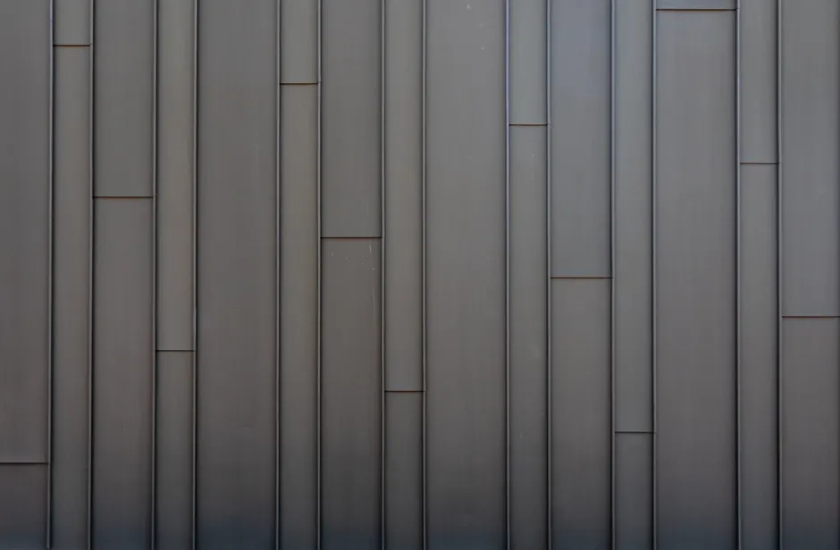 Sleek vertical metal panel wall showcasing a modern minimalist industrial design.