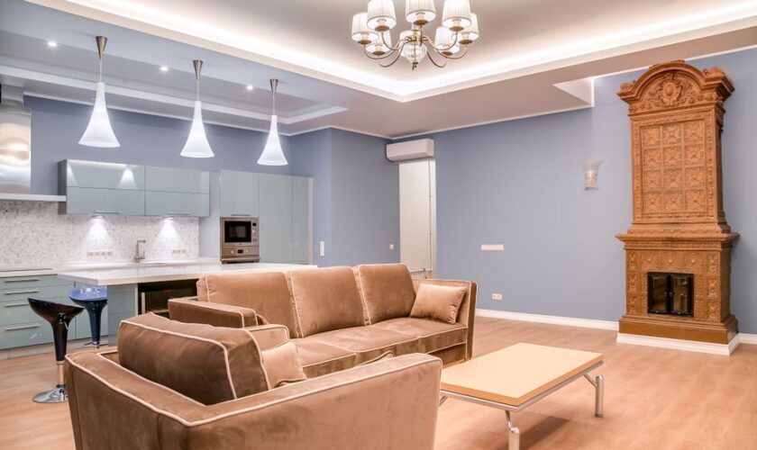 Stylish minimalist living room and kitchen with modern furniture and elegant design.