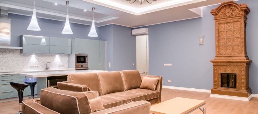Stylish minimalist living room and kitchen with modern furniture and elegant design.
