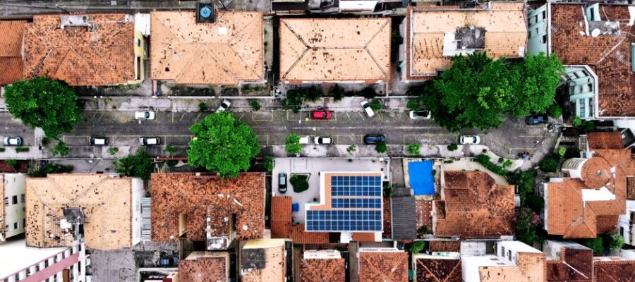 Top-down aerial shot of residential area with solar panels in Rio de Janeiro, Brazil.